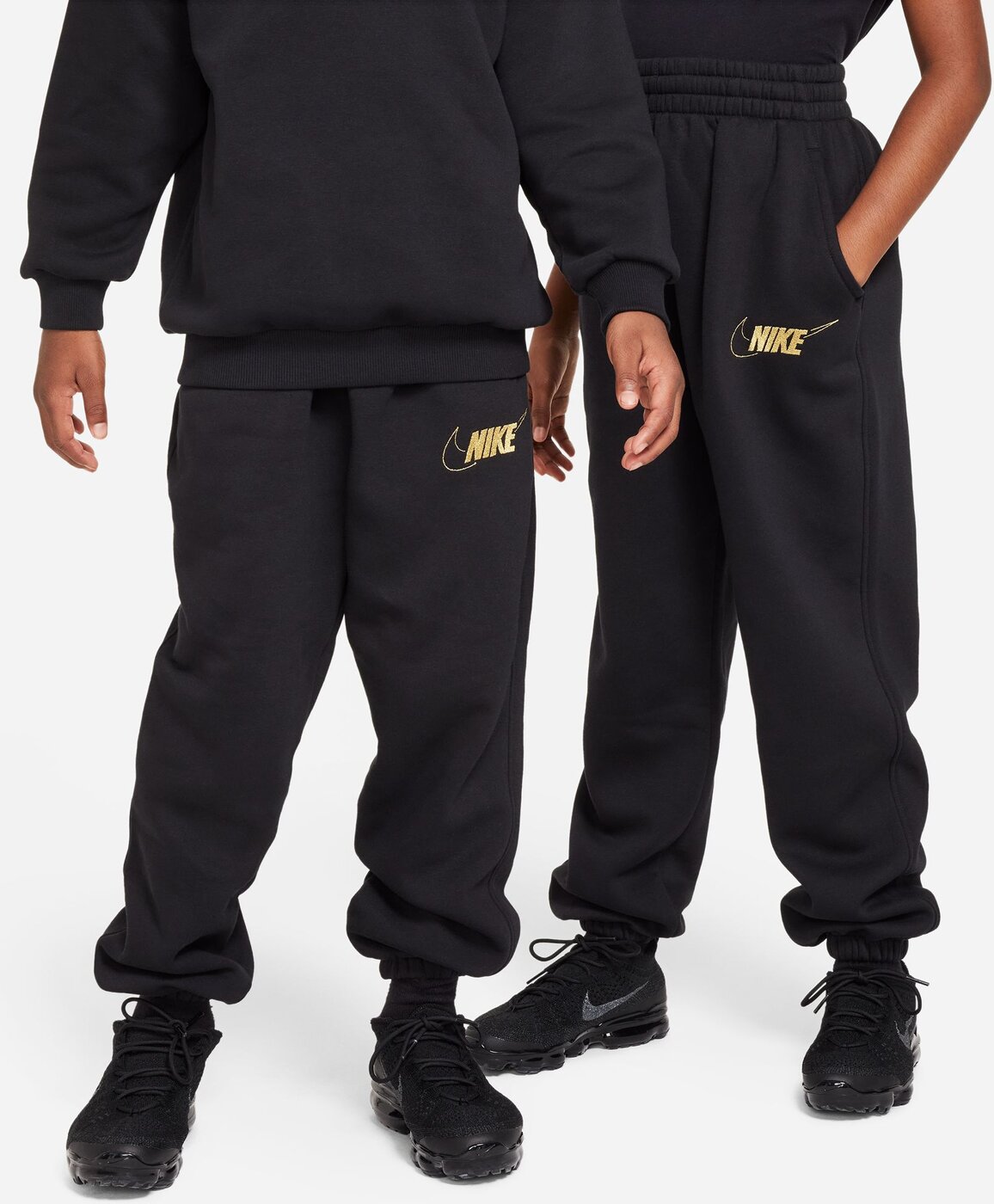 Black and gold nike pants 2025